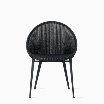 Vincent Sheppard Jack dining chair with a black woven backrest and a steel base