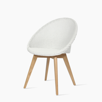 Vincent Sheppard Jack dining chair in white with a woven backrest and an oak wooden base