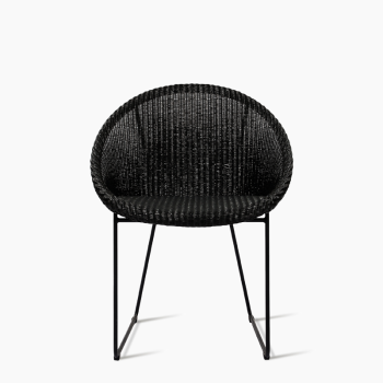 Vincent Sheppard Joe dining chair in black with a woven backrest and a sled base