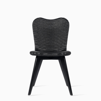 Vincent Sheppard Lily dining chair in black with a woven seat and black wooden legs