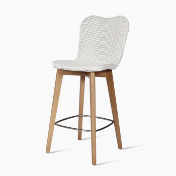 Vincent Sheppard Lily counter stool with a white woven seat and oak wood base