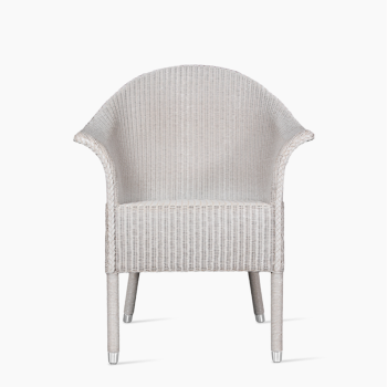 Vincent Sheppard Victor dining armchair in pure white with a woven design and curved armrests