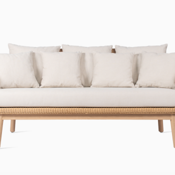 Vincent Sheppard Alex lounge sofa with an oak wood base, woven frame, and beige cushions