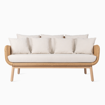 Vincent Sheppard Alex lounge sofa with an oak wood base, woven frame, and multiple beige cushions