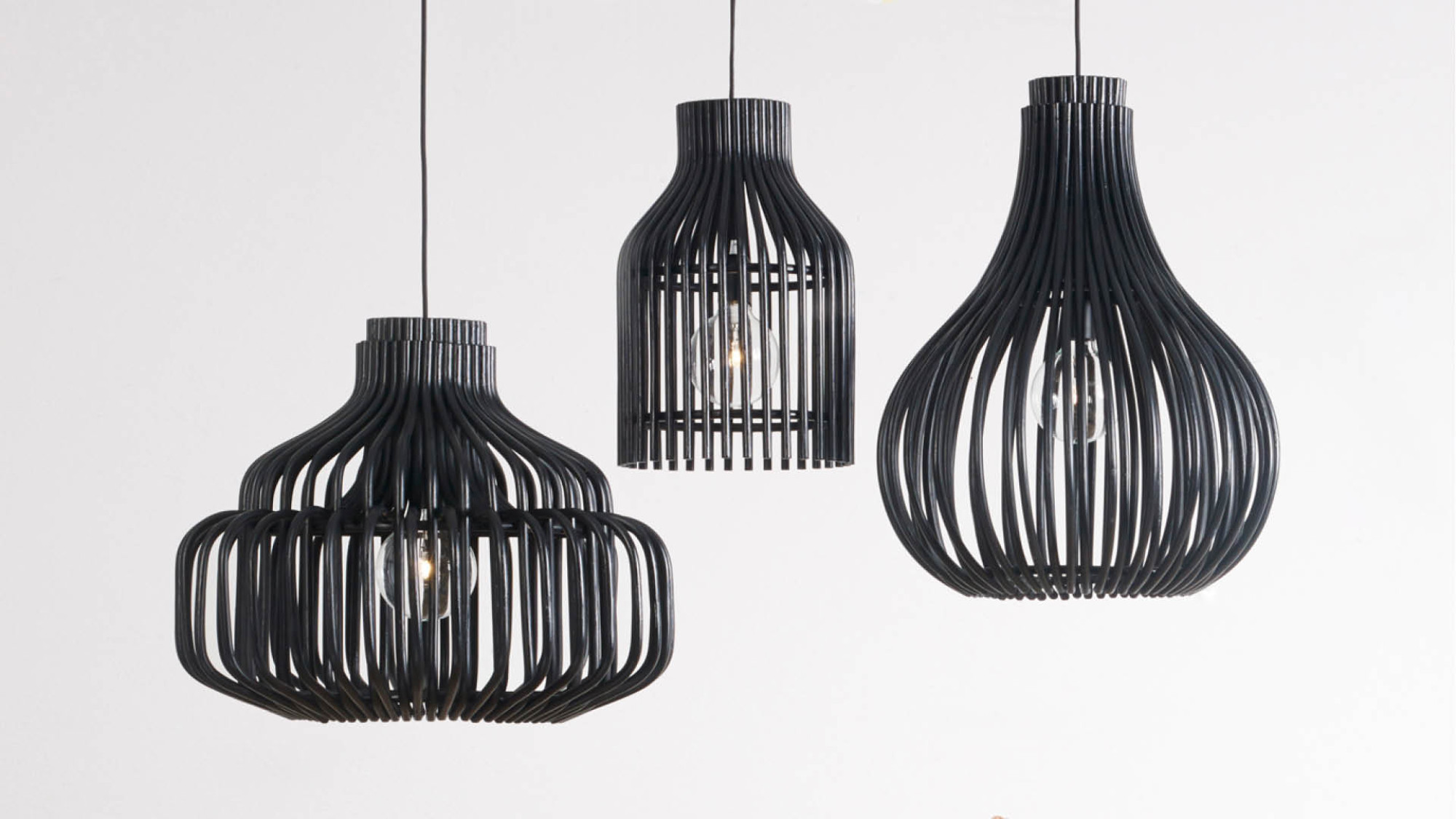 Set of Vincent Sheppard Bulb, Endless, and Firefly hanging lamps in black rattan with open-weave designs and exposed bulbs