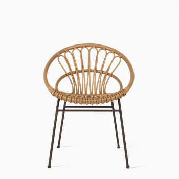 Vincent Sheppard Roxanne dining chair in natural rattan with an open-weave circular backrest and slim metal legs