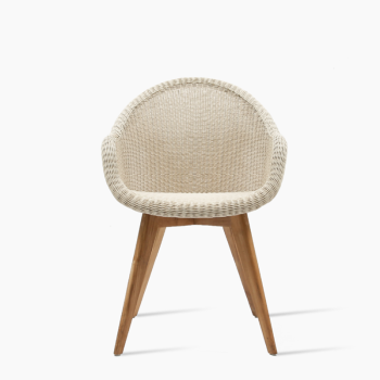 Vincent Sheppard Edgard dining chair in Old Lace with a rounded wicker seat and natural wooden legs