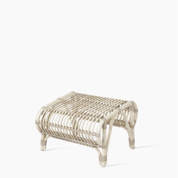 Vincent Sheppard Lucy footrest in off white with a woven rattan design and sleek metal frame.