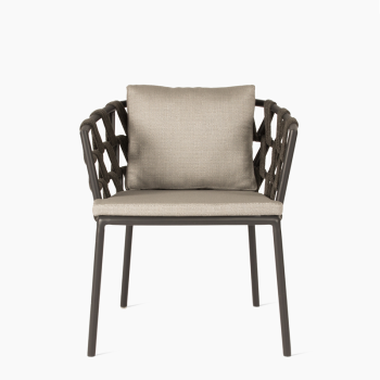 Vincent Sheppard Leo dining chair in lava with zinc-coloured cushions, featuring a rope-woven backrest and cushioned seat and backrest for added comfort.