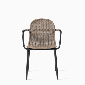 Vincent Sheppard Wicked dining chair in black and taupe, featuring a woven rattan design with a curved backrest and armrests.