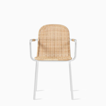  Vincent Sheppard Wicked dining chair with a natural rattan seat and backrest, featuring a white metal frame and armrests.