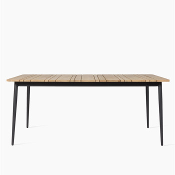 Vincent Sheppard Leo dining table with an untreated teak top and lava-coloured legs.