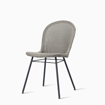  Vincent Sheppard Yann dining chair with a steel A base in pebble colour.