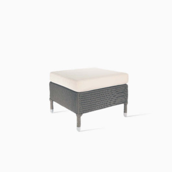 Vincent Sheppard Dovile footrest with a quartz grey frame and cream cushion.