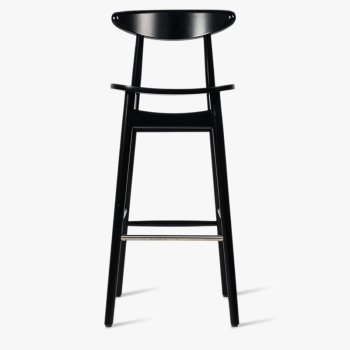  Vincent Sheppard Teo bar stool in black with a minimalist design and a footrest.