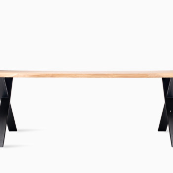 Vincent Sheppard Albert dining table with a natural wood top and black X-shaped base.