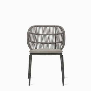 Vincent Sheppard Kodo dining chair in fossil grey with a woven rope backrest and a cushioned seat.