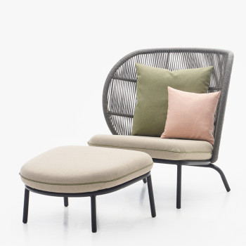 Vincent Sheppard Kodo Cocoon chair in fossil grey with an almond cushion, paired with a matching footrest in fossil grey with an almond cushion.