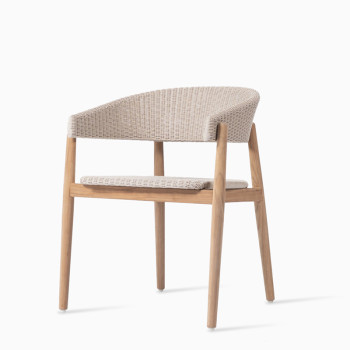 Vincent Sheppard Mona dining chair in old lace with a natural wood frame and woven backrest and seat.