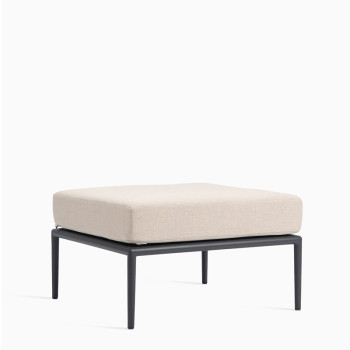 Vincent Sheppard Leo modular footrest with a lava-coloured frame and an almond cushion.