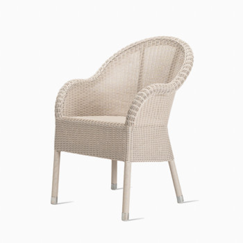 Vincent Sheppard Mia dining chair in old lace wicker, featuring a classic woven design with metal-capped legs.