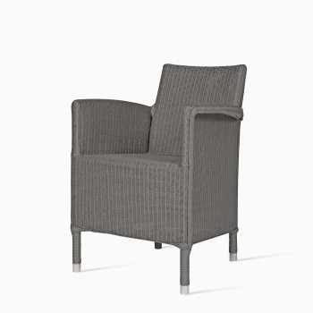 Vincent Sheppard Dovile dining chair in oyster with a woven wicker design and aluminium-capped legs.