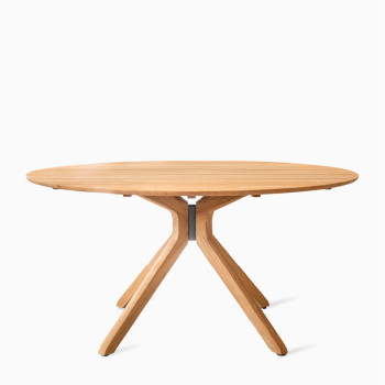  Vincent Sheppard Hermaning dining table with a natural oak finish and a distinctive four-legged base.