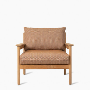 Vincent Sheppard Oda lounge chair with a teak frame and flax fabric in sienna color.