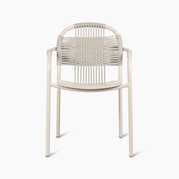 Front view of Vincent Sheppard Cleo dining armchair in dune white, featuring a woven backrest and aluminium frame.