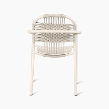 Back view of Vincent Sheppard Cleo dining armchair in dune white, featuring a woven backrest and aluminium frame.