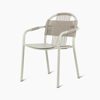 Vincent Sheppard Cleo dining armchair in sage green with a woven backrest and aluminium frame.