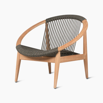 Vincent Sheppard Frida lounge chair in anthracite, with a round wooden frame and woven backrest, shown at a 45-degree angle.