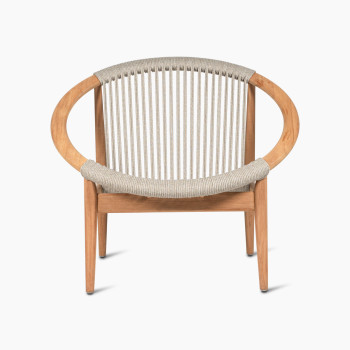 Vincent Sheppard Frida lounge chair in Dune White, front view showcasing the wooden frame and light woven backrest.