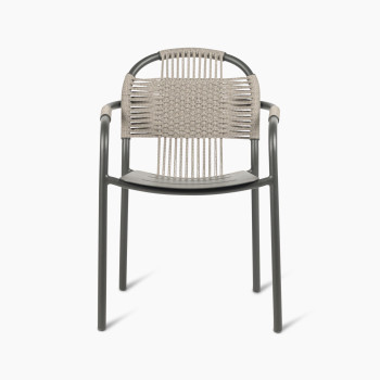 Front view of Vincent Sheppard Cleo dining armchair in fossil grey with a woven backrest and aluminium frame.