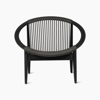 Vincent Sheppard Frida lounge chair in Onyx Black, front view highlighting the dark wooden frame and matching woven backrest.