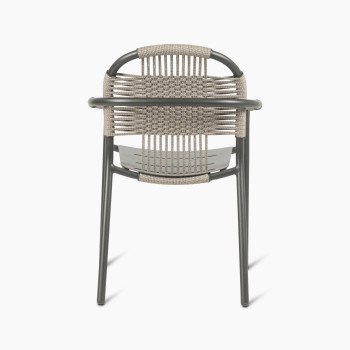 Rear view of Vincent Sheppard Cleo dining armchair in fossil grey, showcasing the woven backrest and aluminium frame.