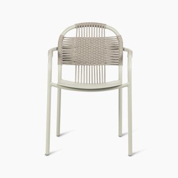 Front view of Vincent Sheppard Cleo dining armchair in sage green, featuring a woven backrest and aluminium frame.