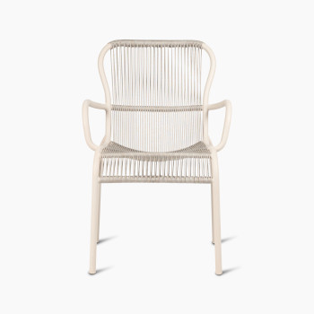 Front view of the Loop dining chair by Vincent Sheppard in Dune white, featuring a woven seat and backrest with smooth, curved armrests.