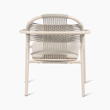  Rear view of the Vincent Sheppard Cleo lounge chair in dune white with an almond-coloured seat cushion, featuring a woven rope backrest