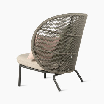 Rear 135-degree view of the Kodo Cocoon in fossil grey with almond seat and decorative cushions in blush and olive green by Vincent Sheppard.