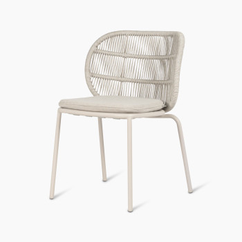 Vincent Sheppard Kodo dining chair with a dune white frame and an almond seat cushion, shown at a 45-degree angle.