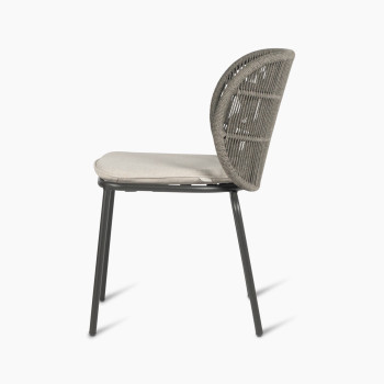 Side view of Vincent Sheppard Kodo dining chair with a fossil grey frame and almond seat cushion.