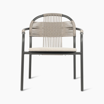 Front view of the Vincent Sheppard Cleo lounge chair in fossil grey with an almond-coloured seat cushion and woven backrest