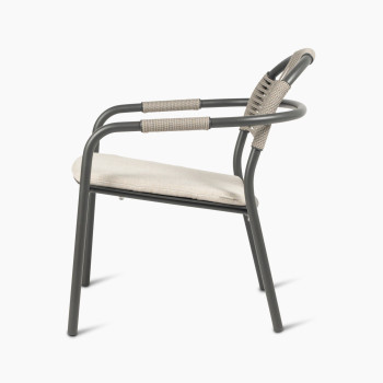 Vincent Sheppard Cleo lounge chair in fossil grey with an almond-coloured seat cushion