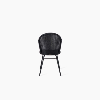 Back view of the Yann dining chair with a black Lloyd Loom seat and steel A-frame base by Vincent Sheppard, displayed against a white background.