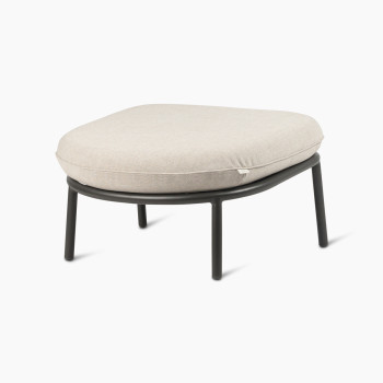 45-degree view of the Kodo footrest in fossil grey with almond cushion by Vincent Sheppard.