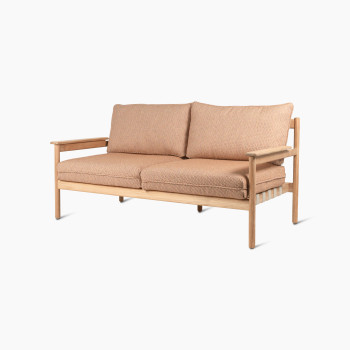 Vincent Sheppard Oda 2.5-seater lounge sofa with light wooden frame, featuring Sienna fabric cushions and armrests.