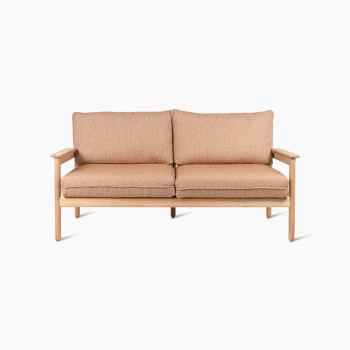 Vincent Sheppard Oda 2.5-seater lounge sofa with light wooden frame and Sienna fabric cushions.