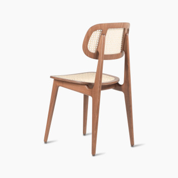 135-degree view of a Titus dining chair in tobacco stained beech with a woven cane backrest and seat.