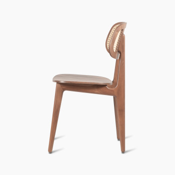 Side view of a Titus dining chair in tobacco stained beech with a woven cane backrest and a solid plywood seat.